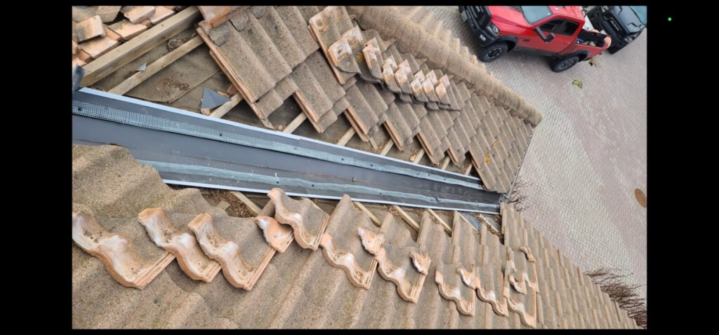 Lead valley replacement on a Marley tile roof.